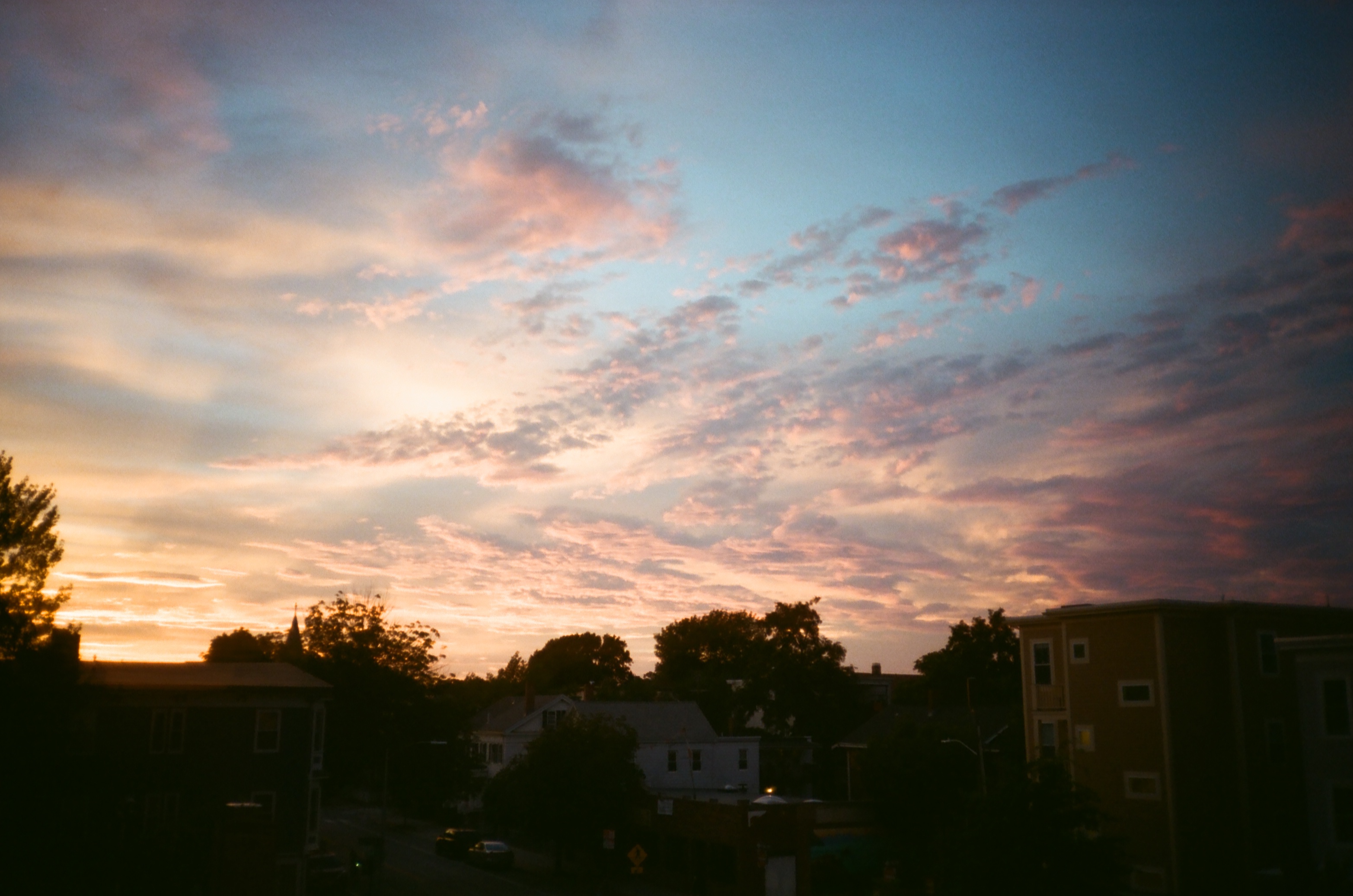 colorful clouds over a neighborhood