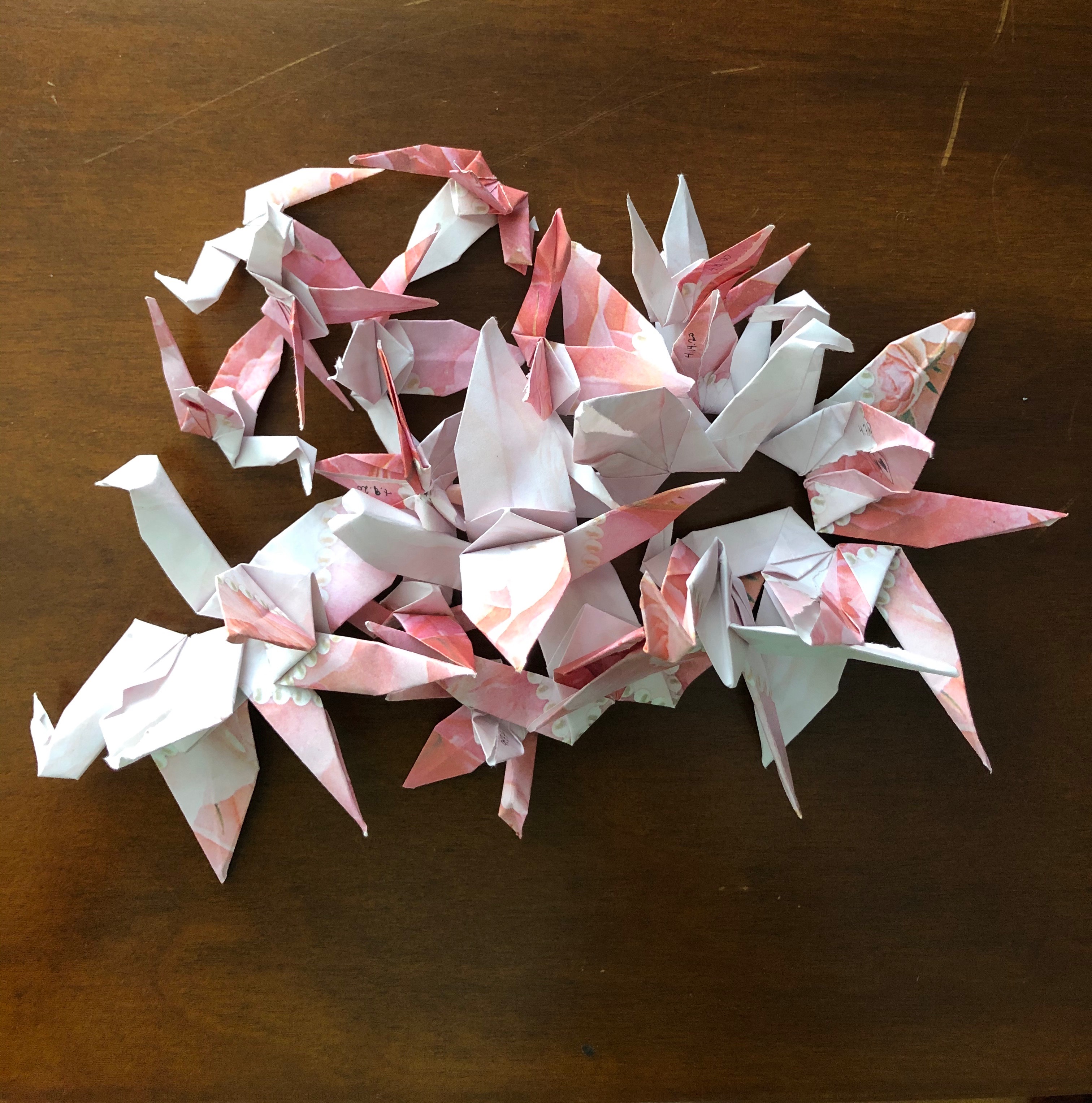 pink and white origami cranes