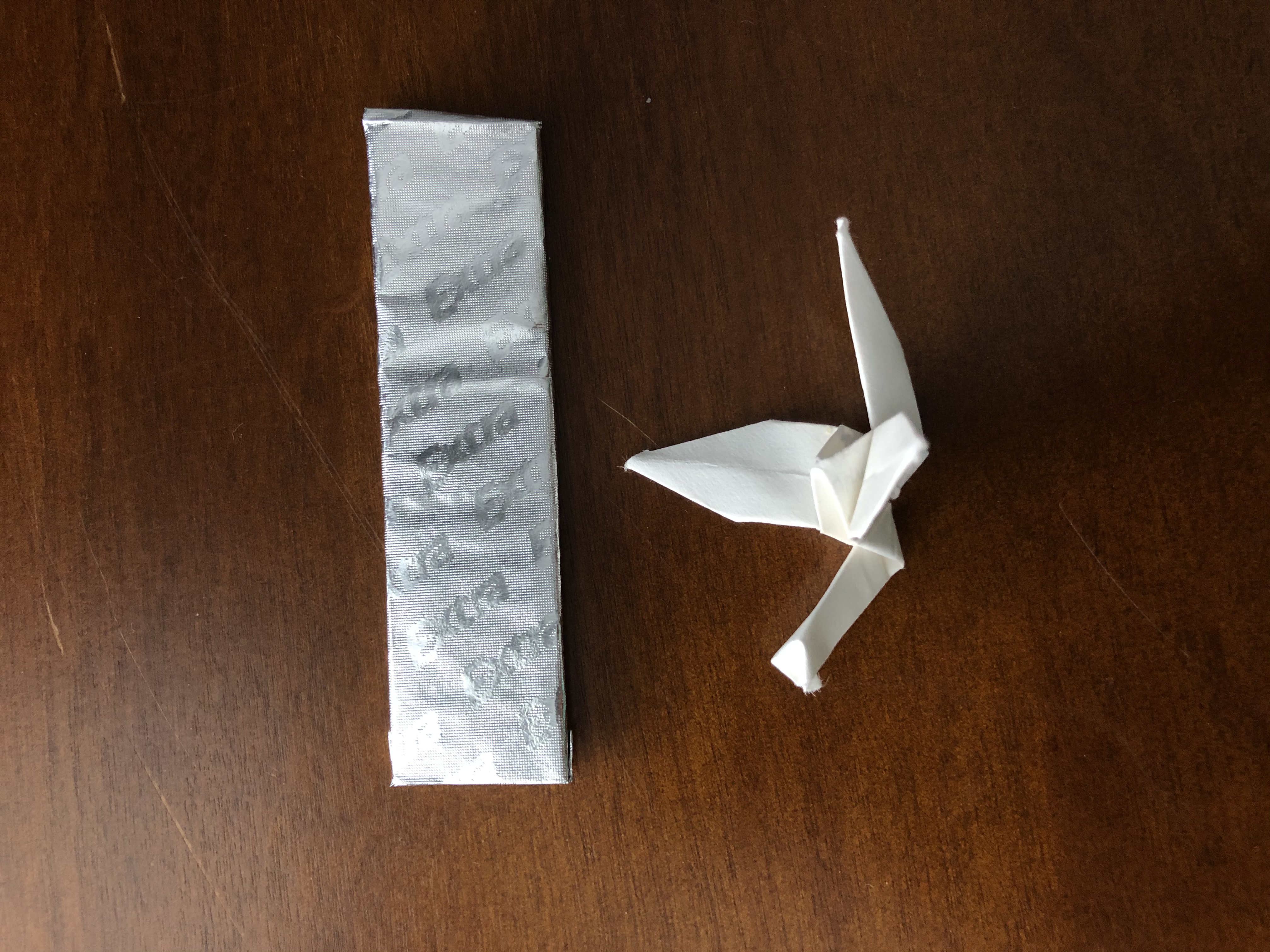 origami crane with gum stick